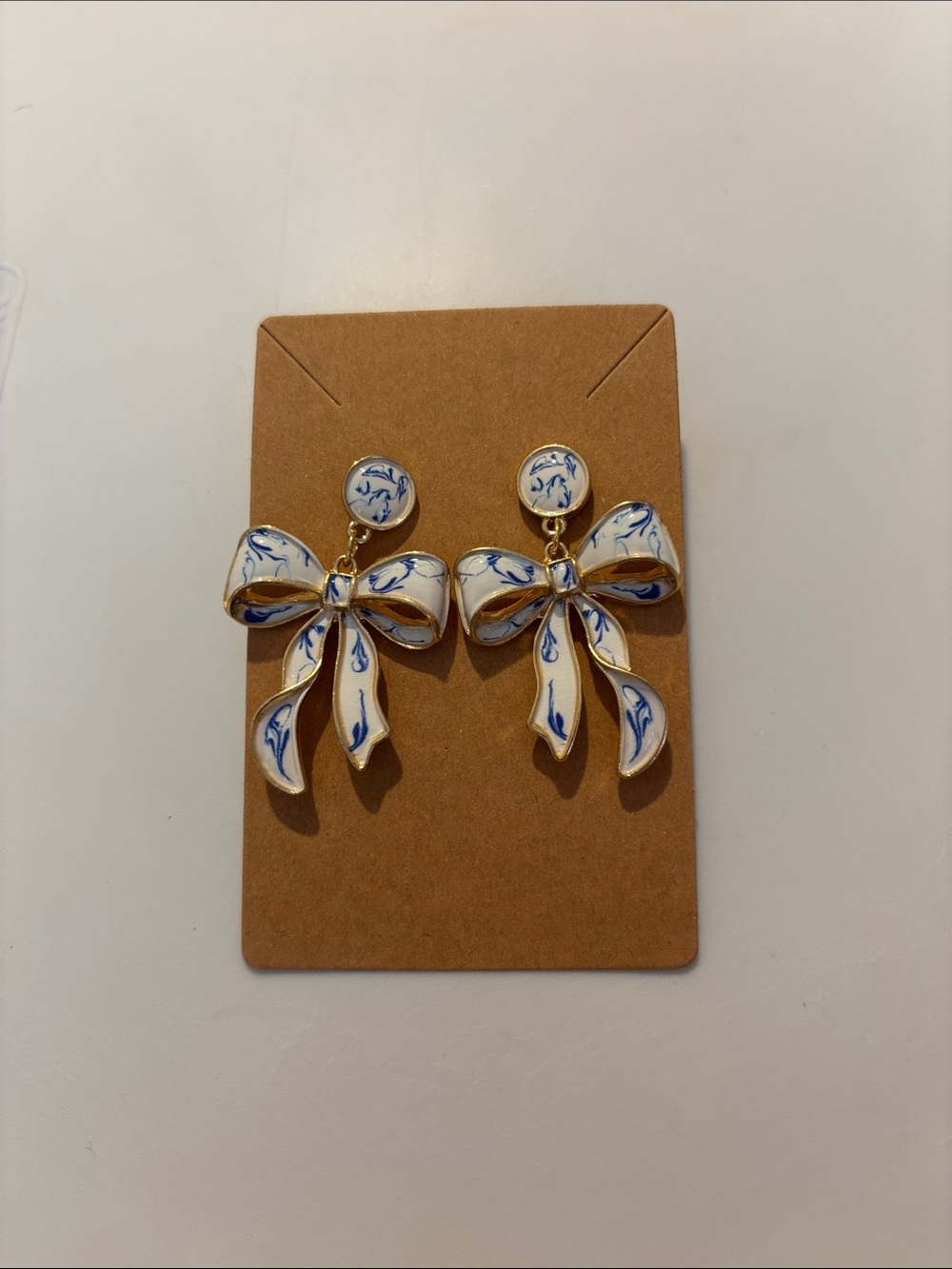 Fashion Jewelry Gold-Tone Bow Drop Earrings with White and Blue Enamel - Picture 3 of 5